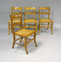 Set of 4 figured maple saber leg chairs