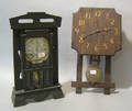 Two oak arts and crafts clocks