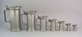 Seven French pewter graduated lidded measures ca 1806