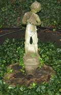 111678 CEMENT FIGURAL GARDEN FOUNTAIN OF BOY WPIPES