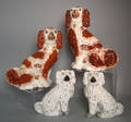 Two pairs of Staffordshire spaniels 19th c