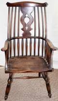 031143 CARVED OAK WINDSOR BACK ARMCHAIR MID 19TH C