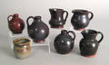 Three miniature redware jugs