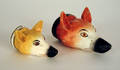 Two Staffordshire fox head stirrup cups ca 1900