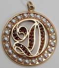 011496 14K YELLOW GOLD GARNET  PEARL PENDANT