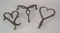 Two wrought iron heart shaped trivets 19th c