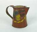 Red tole decorated syrup pitcher