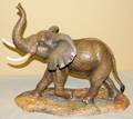 030050 CONNOISSEUR BISQUE FIGURE OF A BROWN ELEPHANT