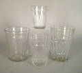 Four blown colorless flip glasses early 19th c
