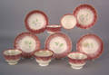 Five red spatter cups and saucers 19th c