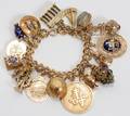 062222 14KT YELLOW GOLD BRACELET HUNG WITH CHARMS