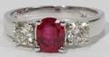 062202 142CT OVAL RUBY  76CT SIDE DIAMOND RING