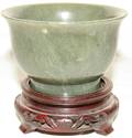 072378 CHINESE CARVED JADE BOWL ON WOOD STAND