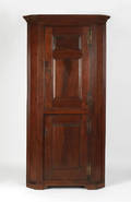 Southeastern Pennsylvania figured walnut one piece corner cupboard ca 1760
