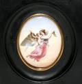 102490 PORCELAIN OVAL PLAQUE PAINTED WWINGED FIGURES