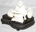 031163 CHINESE CARVED IVORY SEATED MAN WFISH BASKET