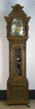 Tiffany  Co carved oak tall case clock with heavily carved case with human figures and lion masks