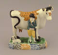 Prattware figure of a farmer and cow early 19th c