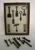Eight wrought iron and wood button hole cutters 18th and 19th c