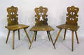 Three Moravian style oak side chairs