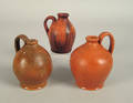 Three miniature redware jugs late 19th c
