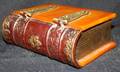 122319 ENGLISH BAKELITE  BRASS BOOK FORMED BOX