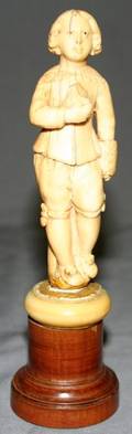 011437 CARVED IVORY FIGURE OF A BOY H45