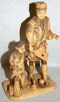 010455 JAPANESE IVORY CARVING OF MAN  BOY