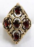 032554 14K YELLOW GOLD  GARNET RING