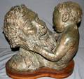 070242 W YERKE BRONZE BUST MAN HOLDING YOUNG BOY
