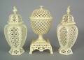 Pair of Leeds pottery reticulated covered urns early 20th c