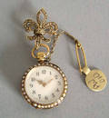 French ladies 18K gold pendant watch with pave seed pearl case