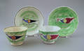 Two green spatter cups and saucers 19th c