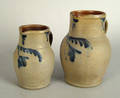 Two similar stoneware pitchers 19th c