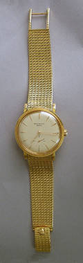 Patek Philippe 18K gold wristwatch with 24K gold rotor and matching 18K gold mesh strap