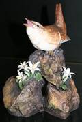 092395 BOEHM BISQUE FIGURE BIRD ON ROCK WFLOWERS