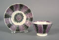 Small purple and black rainbow spatter cup and saucer 19th c