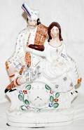 041070 STAFFORDSHIRE SCOTTISH COUPLE W CLOCK C1850