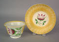 Yellow spatter cup and saucer with tulip 19th c