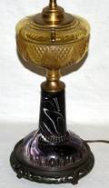020409 OIL LAMP SLAG GLASS BASE W AMBER BASIN