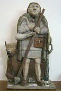 Wood and composition figure of a hunter
