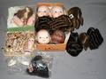 060542 ASSORTED DOLL WIGS HEADS ARMS SHOES ETC