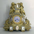 French gilt bronze mantle clock with hand painted porcelain mounts