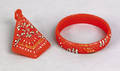 Red bakelite bangle and matching pendant early 20th c