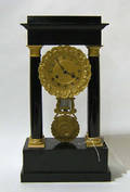 French ebonized and ormolu mounted portico clock