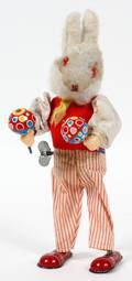 TIN MECHANICAL TOY MUSICAL RABBIT