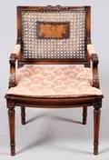 LOUIS XVI STYLE CARVED WALNUT  CANE ARMCHAIR