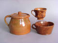 Four redware mugs