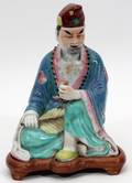 CHINESE MULTICOLORED CERAMIC SEATED FIGURE