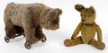 ANTIQUE TOY BEAR ON WHEELS AND SMALL TEDDY BEAR